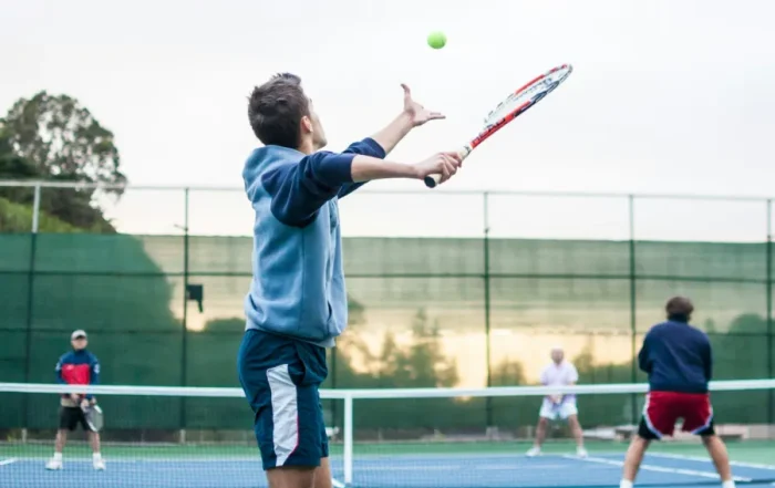 men playing doubles tennis brisbane