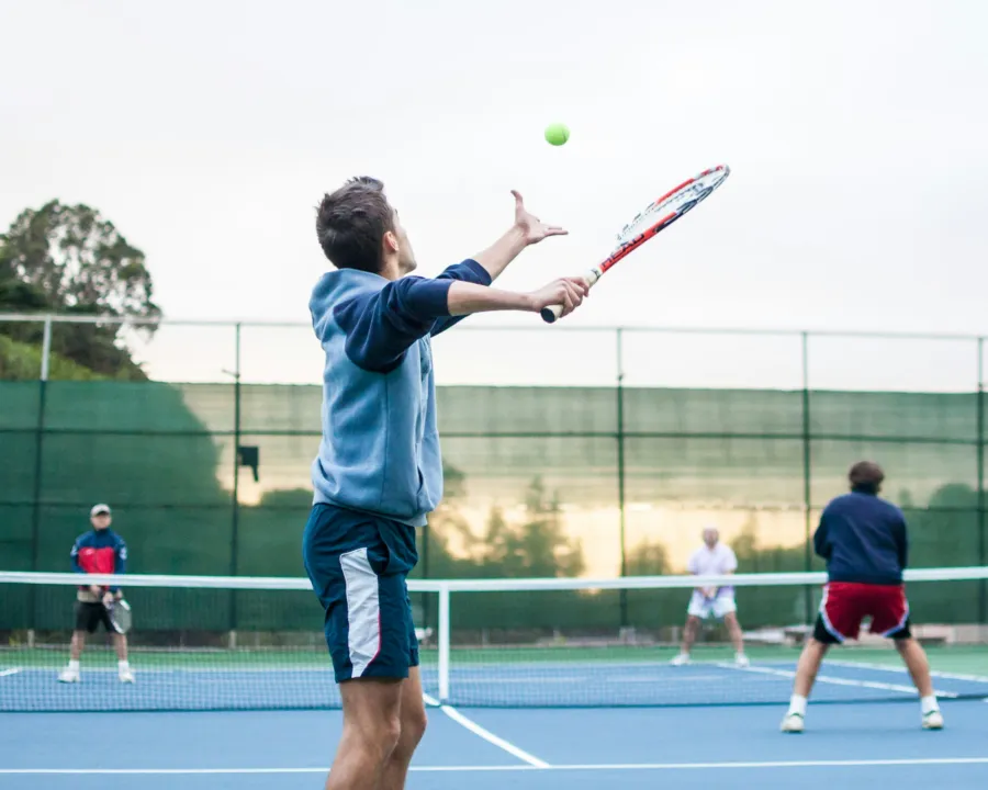 tennis men playing doubles tennis elbow brisbane